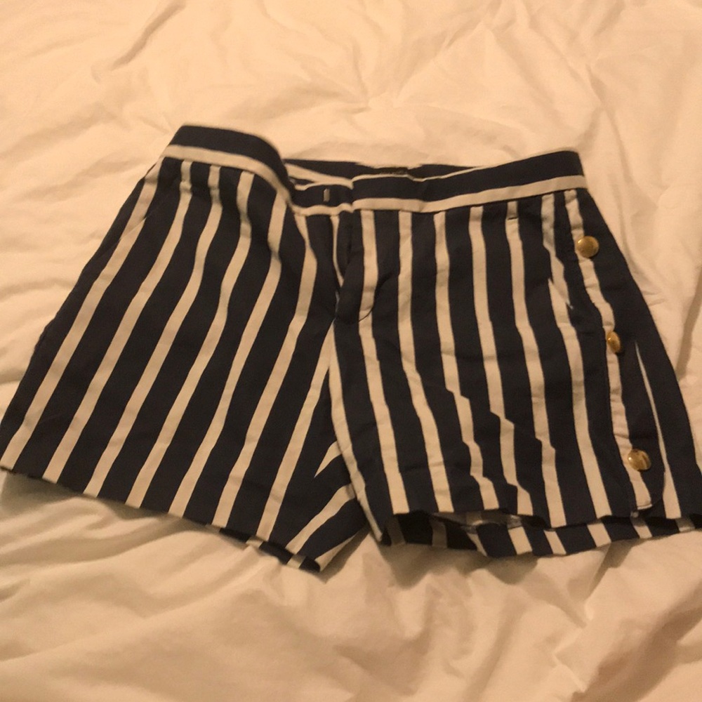 Banana republic tailored shorts with gold buttons.